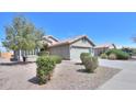Lovely single-story home featuring low-maintenance desert landscaping and a tile roof at 2384 E Santiago Trl, Casa Grande, AZ 85194
