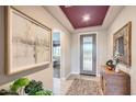 Inviting entryway featuring stylish decor, tile flooring, and plenty of natural light at 25920 W Westcott Dr, Buckeye, AZ 85396