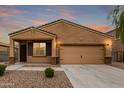 Charming single-story home with neutral stucco, low-maintenance landscaping, and attached two-car garage at 37384 W Prado St, Maricopa, AZ 85138