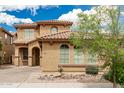 Charming two-story home with a tile roof, landscaped yard, and beautiful architectural details at 3940 E Geronimo St, Gilbert, AZ 85295