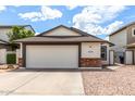 Charming single-story home featuring a spacious two-car garage and low maintenance landscaping at 4319 E Contessa St, Mesa, AZ 85205