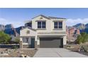Inviting two-story home featuring desert landscaping, a two-car garage, and a neutral color palette at 5075 E Umber Rd, San Tan Valley, AZ 85143