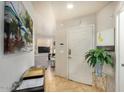 View of the front door with a table, plant, and decor throughout entryway at 5303 N 7Th St # 118, Phoenix, AZ 85014
