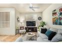 Cozy living room with bright neutral tones, ceiling fan, and natural light at 5303 N 7Th St # 118, Phoenix, AZ 85014