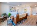 Bright living room with hardwood floors, stylish furniture, and decor for a cozy and inviting atmosphere at 576 N Pasadena --, Mesa, AZ 85201