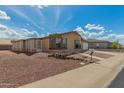 Charming one-story home boasts a screened-in porch and gravel landscaping for easy maintenance at 5901 E Leonora St, Mesa, AZ 85215