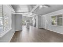 Spacious living room with wood-look floors, neutral paint and plenty of natural light at 8103 E Southern Ave # 205, Mesa, AZ 85209