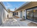 Covered patio featuring outdoor dining set and storage shed, ideal for entertaining at 8827 N New World Dr, Glendale, AZ 85302