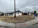 This single-story home showcases a corner lot, enhancing its curb appeal with ample space at 14839 N 29Th Dr, Phoenix, AZ 85053