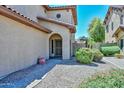 Inviting front entrance featuring manicured desert landscaping and a stylish security door at 15953 W Custer Ln, Surprise, AZ 85379