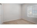 Cozy bedroom with neutral carpet, fresh paint, and bright natural light at 17776 W Getty Dr, Goodyear, AZ 85338
