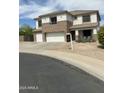 Attractive two-story home with a three-car garage and well-maintained landscaping at 1849 S 225Th Dr, Buckeye, AZ 85326