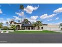 Stunning home with mature landscaping, a two-car garage, and a bright stucco exterior at 1905 N Calle Maderas --, Mesa, AZ 85213