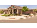 Beautiful corner lot with mature landscaping and sidewalk access on a sunny day at 23162 E Canary Way, Queen Creek, AZ 85142