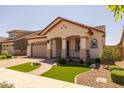 Attractive single-Gathering home with a tile roof, a paver driveway and nicely-maintained landscaping at 23163 E Canary Way, Queen Creek, AZ 85142