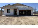 New construction home featuring an incomplete facade and a covered porch perfect for relaxing outdoors at 24083 W Bowker St, Buckeye, AZ 85326