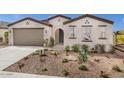 Charming single-story home featuring desert landscaping, a neutral color scheme, and a welcoming arched entryway at 2437 W Jessica Ln, Phoenix, AZ 85041