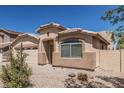 Delightful single-story home boasting a well-manicured front yard and a two-car garage at 2794 E Cowboy Cove Trl, San Tan Valley, AZ 85143