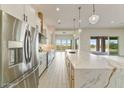 Spacious kitchen with granite counters, island sink, and stainless steel appliances at 31505 N 166Th Pl, Scottsdale, AZ 85262