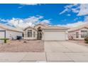 Charming single-Gathering home featuring a tile roof, desert landscaping, and a two-car garage at 3349 E Lavey Ln, Phoenix, AZ 85032