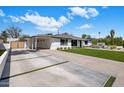 Spacious driveway leads to a covered carport, providing ample parking and easy access to the home at 3630 N 39Th St, Phoenix, AZ 85018