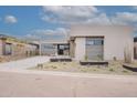 Beautiful desert landscape with a paved driveway leading to a modern home at 37200 N Cave Creek Rd # 1019, Scottsdale, AZ 85262