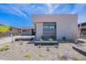 Landscaped front yard featuring desert plants and modern architecture with stone accents, offering curb appeal at 37200 N Cave Creek Rd # 1019, Scottsdale, AZ 85262