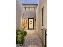 Inviting entryway with desert plants, stone pavers, and courtyard access at 37200 N Cave Creek Rd # 1034, Scottsdale, AZ 85262