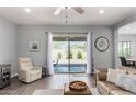 Cozy living room with tile floors, modern furniture, and a view of the backyard at 4361 S Electron --, Mesa, AZ 85212