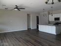 Spacious living room features hardwood floors and a modern ceiling fan at 4514 N 198Th Ln, Litchfield Park, AZ 85340