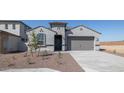Charming single-story home featuring desert landscaping, a two-car garage, and a welcoming front entrance at 7425 W Buckhorn Trl, Peoria, AZ 85383