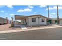 Charming single-story home with a covered carport, desert landscaping, and a welcoming curb appeal at 8103 E Southern Ave # 154, Mesa, AZ 85209