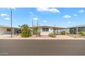 Charming single-story home with desert landscaping, covered parking, and inviting curb appeal at 8103 E Southern Ave # 222, Mesa, AZ 85209
