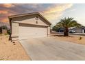 Attached two-car garage with a spacious driveway offers convenient parking and storage at 8502 W Pierson St, Phoenix, AZ 85037