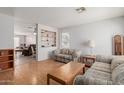 Cozy living room with hardwood floors, comfortable seating and an open layout at 8502 W Pierson St, Phoenix, AZ 85037