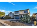 Charming two-story home with low maintenance desert landscaping, attached two-car garage, and cozy front porch at 920 E Leslie E Ave, San Tan Valley, AZ 85140