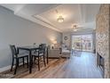 Bright living room features wood floors, fireplace, and a dining area at 9451 E Becker Ln # 2004, Scottsdale, AZ 85260
