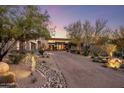 Beautiful home with desert landscaping, mature trees, and a long driveway leading to the entrance at 10283 E Running Deer Trl, Scottsdale, AZ 85262