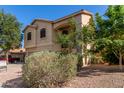 Two-story home with a two-car garage, neutral colors, and low-maintenance desert landscaping at 12571 W Clarendon Ave, Avondale, AZ 85392