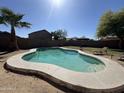 Sparkling pool featuring a baja shelf for relaxing on sunny days in your own private backyard oasis at 12571 W Clarendon Ave, Avondale, AZ 85392