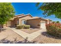 Charming single-story home with low-maintenance landscaping at 16112 W Buchanan St, Goodyear, AZ 85338