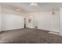 Spacious living room features an open floor plan and neutral color palette at 16112 W Buchanan St, Goodyear, AZ 85338