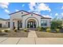 Welcoming home with a well-manicured lawn at 17396 W Crawfordsville Dr, Surprise, AZ 85388
