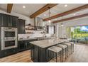 Modern kitchen featuring a large center island with seating at 17396 W Crawfordsville Dr, Surprise, AZ 85388