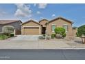 Beautiful single-story home with desert landscaping, two-car garage, and inviting facade at 23871 N 167Th Ln, Surprise, AZ 85387
