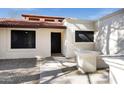 Close up of front entrance showcasing a modern design with a tile roof and desert landscaping at 250 E Barbarita Ave, Gilbert, AZ 85234