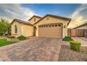Charming desert home with a two car garage and paver driveway, mature trees and manicured bushes at 269 E Horseshoe Dr, Chandler, AZ 85249