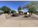 Charming single-story home featuring desert landscaping and a well-maintained front yard at 2735 E Harwell Rd, Gilbert, AZ 85234