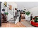 Inviting entryway with staircase, decorative elements, and hardwood floors at 288 E Baylor Ln, Gilbert, AZ 85296
