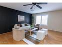 Bright living room boasts an open layout, comfortable seating, and wood floors at 288 E Baylor Ln, Gilbert, AZ 85296